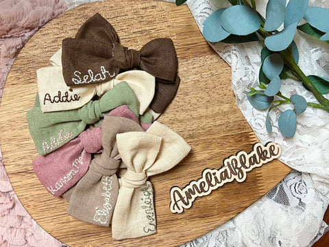 Embroidered name bow